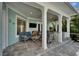 Inviting covered patio featuring outdoor seating, a built-in grill, and a TV for ultimate outdoor enjoyment at 426 Islebay Dr, Apollo Beach, FL 33572