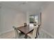 Comfortable dining room with light wood floors and window views at 426 Islebay Dr, Apollo Beach, FL 33572