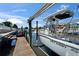Boat on a lift at private dock; enjoy waterfront living at 426 Islebay Dr, Apollo Beach, FL 33572