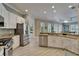 Spacious kitchen with stainless steel appliances, granite counters, and open layout at 426 Islebay Dr, Apollo Beach, FL 33572