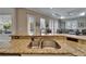 Close up of the granite counter and sink, with views to the living space at 426 Islebay Dr, Apollo Beach, FL 33572