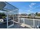 Enjoy tranquil canal views from the screened-in patio, ideal for relaxing and entertaining outdoors at 426 Islebay Dr, Apollo Beach, FL 33572