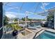 Charming outdoor pool area with waterfront views, featuring lounge chairs for ultimate relaxation and enjoying the scenic surroundings at 426 Islebay Dr, Apollo Beach, FL 33572