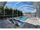 Beautiful backyard pool area surrounded by lush landscaping, offering a private oasis for relaxation and recreation at 426 Islebay Dr, Apollo Beach, FL 33572