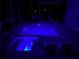 Inviting screened-in pool and spa with colored lights for nighttime enjoyment at 426 Islebay Dr, Apollo Beach, FL 33572
