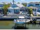 Back of the house with screened in lanai, boat lift, and access to the canal at 426 Islebay Dr, Apollo Beach, FL 33572