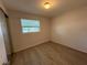 Bedroom featuring updated flooring and a window at 4316 70Th N Ave, Pinellas Park, FL 33781