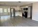 Modern kitchen with stainless steel appliances, white cabinets and luxury vinyl flooring at 4316 70Th N Ave, Pinellas Park, FL 33781