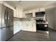 Updated kitchen features white cabinets, stainless steel appliances, and quartz countertops at 4316 70Th N Ave, Pinellas Park, FL 33781