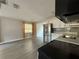 Open kitchen features stainless steel appliances, white cabinets and gray subway tile backsplash at 4316 70Th N Ave, Pinellas Park, FL 33781