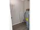 Utility room with water heater, storage shelving, and modern flooring at 4316 70Th N Ave, Pinellas Park, FL 33781