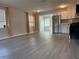 Spacious living room with modern flooring and an open view to the updated kitchen at 4316 70Th N Ave, Pinellas Park, FL 33781