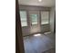 Bright living room features wood flooring and a window providing natural light at 4316 70Th N Ave, Pinellas Park, FL 33781