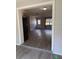 Bright living room featuring gray vinyl floors and a window overlooking the front yard at 4316 70Th N Ave, Pinellas Park, FL 33781