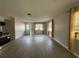 Spacious living room with neutral paint, modern floors, and natural light from multiple windows at 4316 70Th N Ave, Pinellas Park, FL 33781