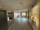 Open-concept living room featuring new flooring and lots of natural light at 4316 70Th N Ave, Pinellas Park, FL 33781