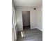 Bright room boasts neutral paint, modern flooring, a window, and a closet at 4316 70Th N Ave, Pinellas Park, FL 33781