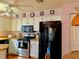 Kitchen with white cabinetry, stainless steel appliances, and butcher block counters at 4556 Blossom Blvd # B, Zephyrhills, FL 33542