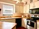 Bright kitchen featuring butcher block countertops, white cabinets, and stainless steel appliances at 4556 Blossom Blvd # B, Zephyrhills, FL 33542