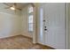 Inviting foyer with ceramic tile flooring, vaulted ceiling, and a window above the front door at 476 Denise St, Tarpon Springs, FL 34689