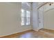 Bright foyer with ceramic tile flooring, vaulted ceiling, and a window above the front door at 476 Denise St, Tarpon Springs, FL 34689