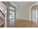 Spacious living room with tile floors, staircase, and sliding glass doors leading to the pool at 476 Denise St, Tarpon Springs, FL 34689