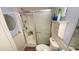 Bathroom featuring a shower with glass door and convenient shelving at 4851 W Gandy Blvd # B12L28, Tampa, FL 33611