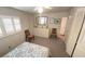 Bright bedroom featuring shuttered windows, dresser, and closet at 4851 W Gandy Blvd # B12L28, Tampa, FL 33611
