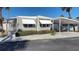 Charming single-story home with awning, covered porch and driveway, perfect for easy living and outdoor enjoyment at 4851 W Gandy Blvd # B12L28, Tampa, FL 33611