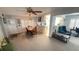Inviting living room featuring a ceiling fan and an adjacent dining area and kitchen at 4851 W Gandy Blvd # B12L28, Tampa, FL 33611