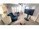 Cozy living room featuring natural light, comfortable seating, and a functional layout for relaxation and entertainment at 4851 W Gandy Blvd # B12L28, Tampa, FL 33611