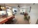 Open-concept living room and dining area with modern ceiling fan and neutral carpet at 4851 W Gandy Blvd # B12L28, Tampa, FL 33611
