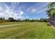 View of the adjacent green golf course for leisure activity and scenic views from the property at 522 Planters Manor Way, Bradenton, FL 34212