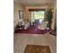Comfortable living room featuring a plush rug and scenic views of the outdoor space at 522 Planters Manor Way, Bradenton, FL 34212