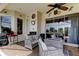 Relaxing outdoor patio with comfortable seating, ceiling fans, and decorative accents at 522 Planters Manor Way, Bradenton, FL 34212