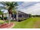 Screened lanai with pool, adjacent to golf course, offers privacy and picturesque views at 522 Planters Manor Way, Bradenton, FL 34212