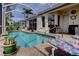 Inviting pool area with lush landscaping and ample space for outdoor enjoyment at 522 Planters Manor Way, Bradenton, FL 34212