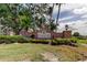 Community entrance sign for Greenfield Plantation featuring beautiful brickwork and lush landscaping at 522 Planters Manor Way, Bradenton, FL 34212
