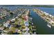 Stunning waterfront home with lush landscaping and private boat dock, offering direct access to the open waters at 533 Lillian Dr, Madeira Beach, FL 33708