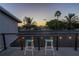 This home's upper balcony provides a cozy space to relax and take in the neighborhood views at 533 Lillian Dr, Madeira Beach, FL 33708