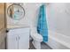 Bathroom featuring granite vanity, shower/tub and marble style walls at 533 Lillian Dr, Madeira Beach, FL 33708