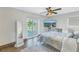 Bedroom offers water view, wood floors, and full-length mirror at 533 Lillian Dr, Madeira Beach, FL 33708