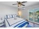 Bedroom boasts water view and access to an outdoor patio at 533 Lillian Dr, Madeira Beach, FL 33708