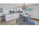 Kitchen and dining area showcase a seamless open floor plan for modern living at 533 Lillian Dr, Madeira Beach, FL 33708