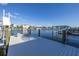 Dock featuring seating to enjoy the waterfront views and an easy access to the open water at 533 Lillian Dr, Madeira Beach, FL 33708