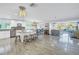 Open-concept kitchen with an island and stainless steel appliances, flowing into the living area at 533 Lillian Dr, Madeira Beach, FL 33708