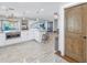 Open kitchen with island, stainless appliances, and direct access to other rooms at 533 Lillian Dr, Madeira Beach, FL 33708