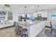 Kitchen with a large center island, stainless steel appliances, and pendant lighting above the island at 533 Lillian Dr, Madeira Beach, FL 33708