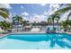 Backyard pool with patio, lounge chairs and a dock in the canal for waterfront enjoyment at 533 Lillian Dr, Madeira Beach, FL 33708