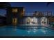 Back of house with a pool, second story balcony and a view from the sliding glass doors into the living room at 533 Lillian Dr, Madeira Beach, FL 33708
